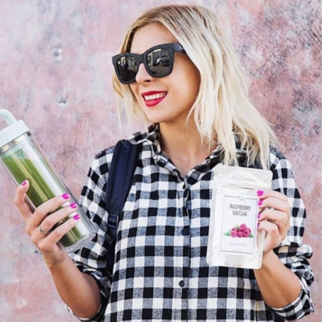 Woman holding 3 Leaf Tea Raspberry Matcha