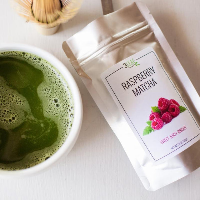 Bag of rapberry matcha next to a prepared cup