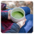 Person holding frothy bowl of matcha